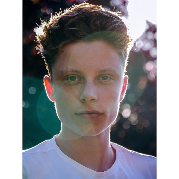 close-up portrait of young man in park