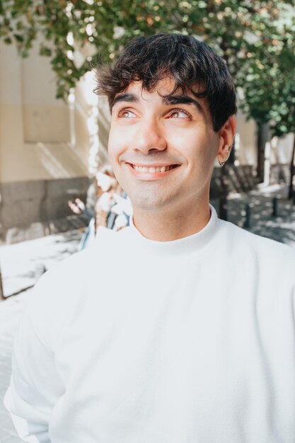 Close up portrait of a young smiling man, bright future, liberty and freedom concepts