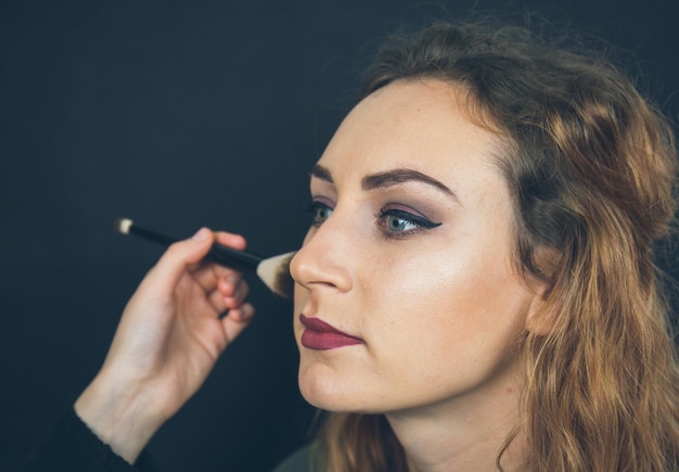 Close-up portrait of young woman looking away