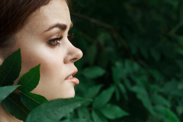 Close-up portrait of young woman looking away