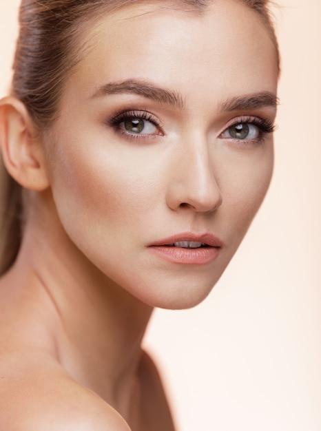 Close-up portrait of a young woman posing