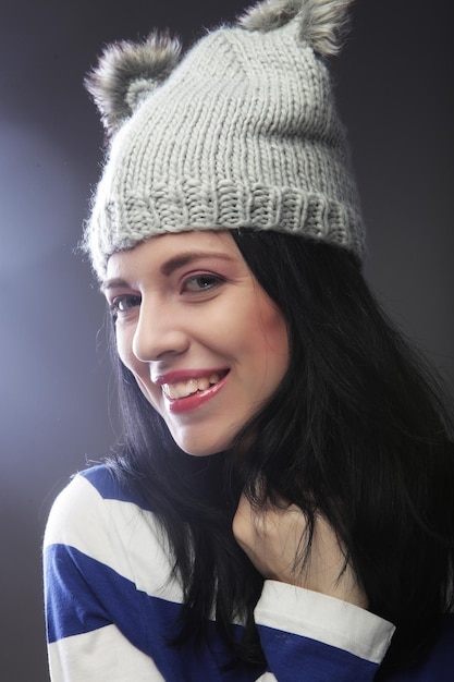 Close up portrait of young woman wearing funny hat