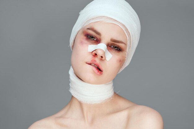 Close-up portrait of young woman wearing mask against black background