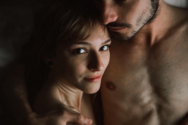 Close-up portrait of young woman with boyfriend