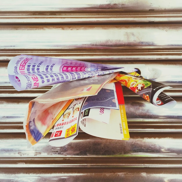 Close-up of posters in corrugated iron