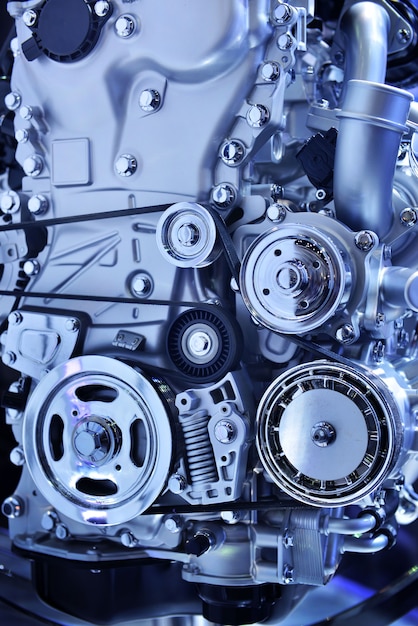 Close up powerful engine of a car in blue tone 