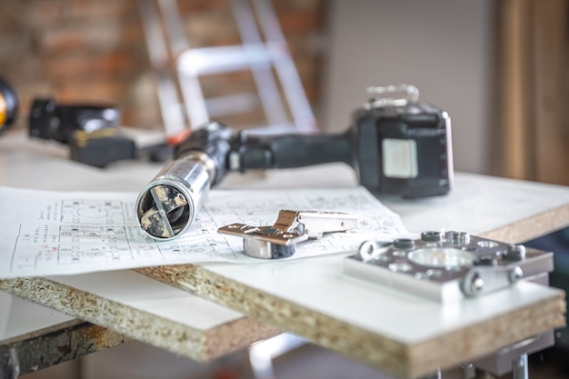 Close-up of precision drilling fixture and other carpenter's tools.