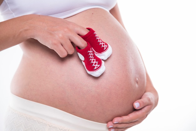 Close up of pregnant belly.