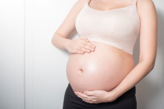 Close up pregnant woman expecting a baby