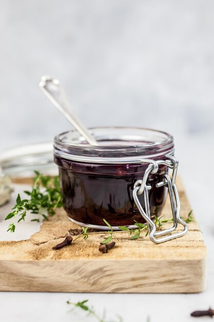 Close-up of preserves in jar on cutting board