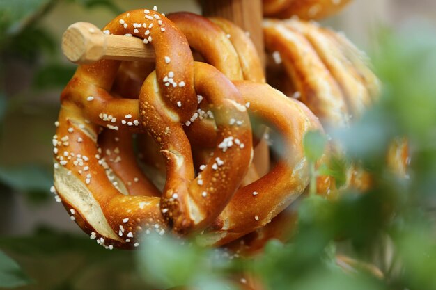 Close-up of pretzels handing on wood