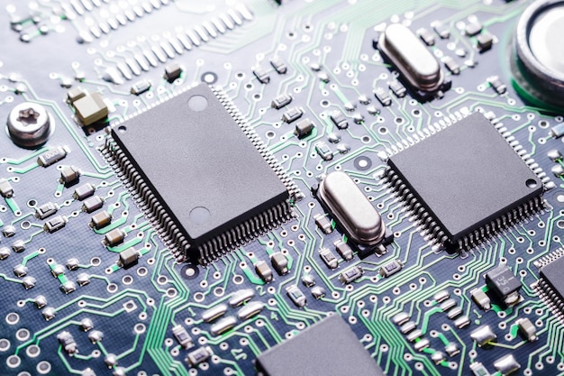 Close up of printed circuit board with electronic components selective focus