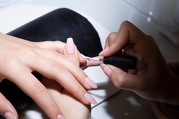 Close up of process manicure at beauty salon