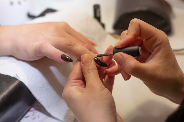 Close up of process manicure at beauty salon