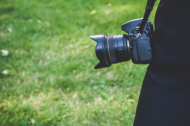 Close up on professional photo video camera