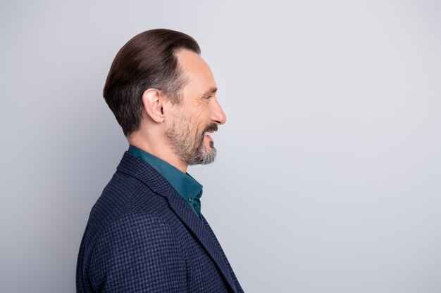 Close-up profile side portrait of nice middle age man in suit  