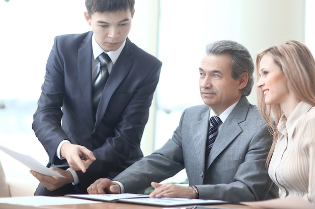 Close up.project Manager and business team at a Desk in the office.