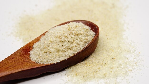 Close up of psyllium ispaghula husk in wooden spoon