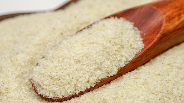 Close up of psyllium ispaghula husk in wooden spoon