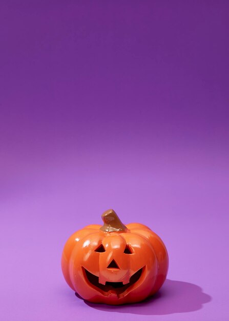 Close-up of pumpkin against colored background
