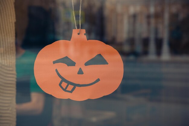 Photo close-up of pumpkin against orange wall