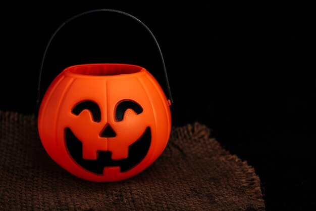 Close-up of pumpkin face against black background