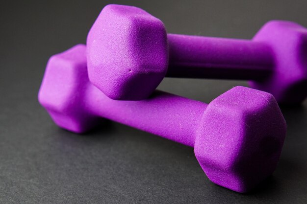 Close-up of purple dumbbells