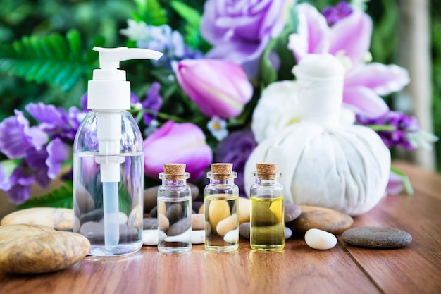 Close-up of purple flower in glass bottle on table