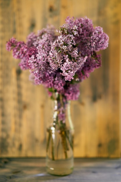 Close-up of purple flower vase on table