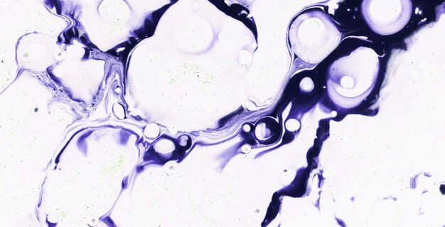 A close up of purple paint with a black background