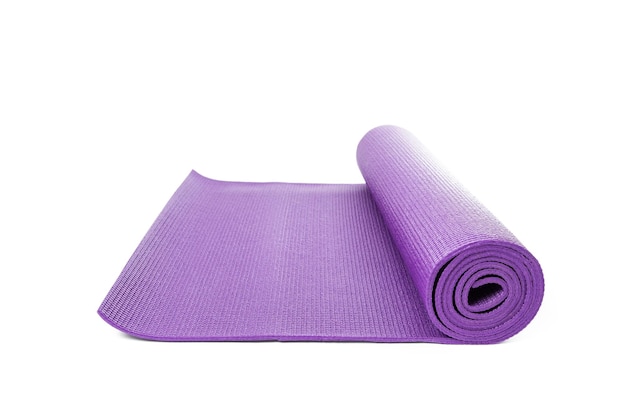 Close up purple yoga mat for exercise isolated