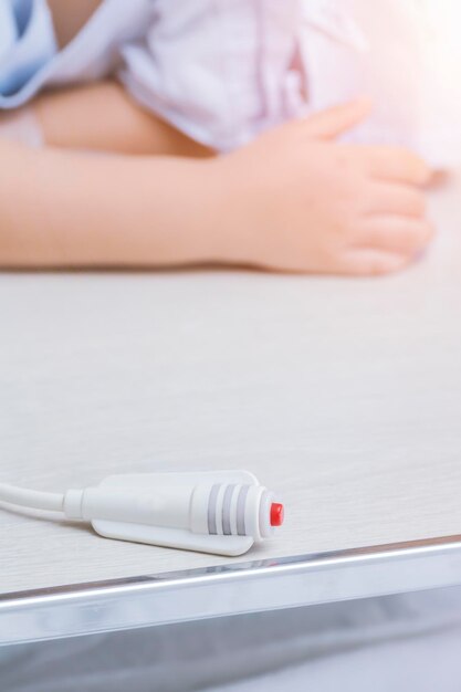 Close-up of push button on table at hospital