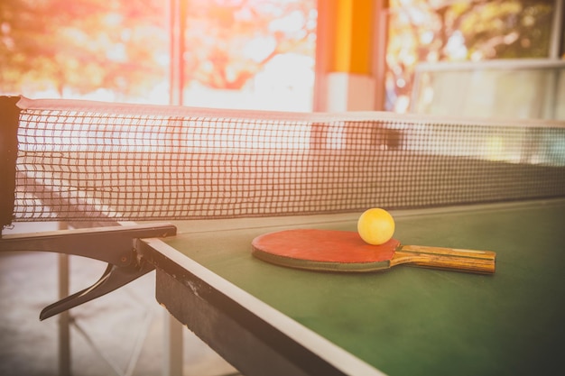 Close-up of racket and ball table