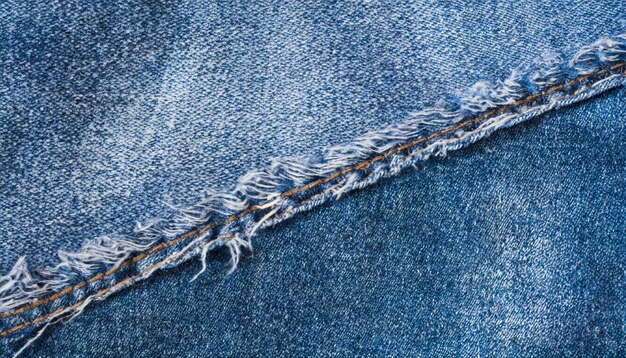 close up ragged blue denim texture simple classic indigo jeans background close up copy space