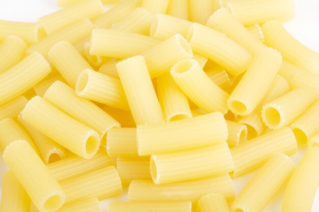 Close up of raw italian pasta on white