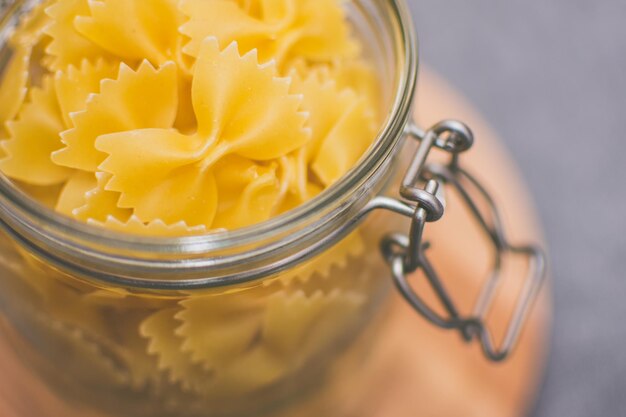 Close-up of raw pasta in jar
