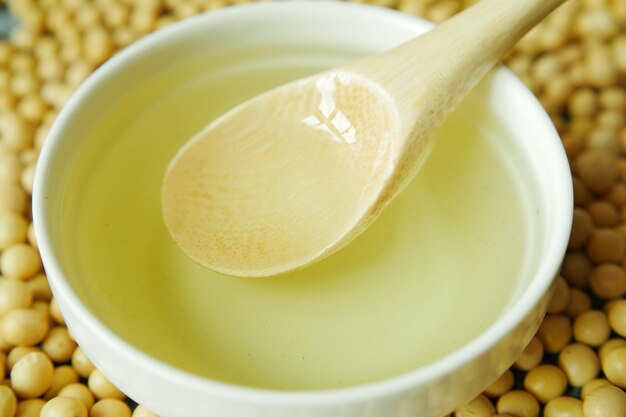 Close up of Raw soy bean seed oil in a container