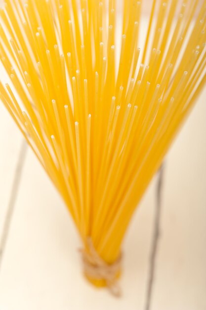 Close-up of raw spaghetti on table