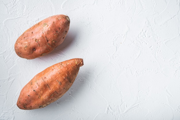 Close up on raw whole sweet potatoes