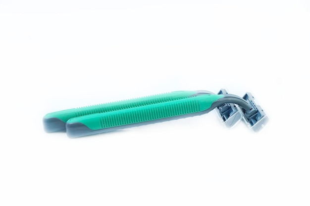 close-up of razors against white background