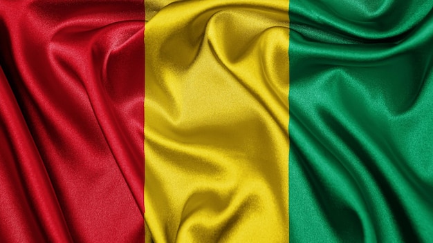 Close up realistic texture flag of Guinea