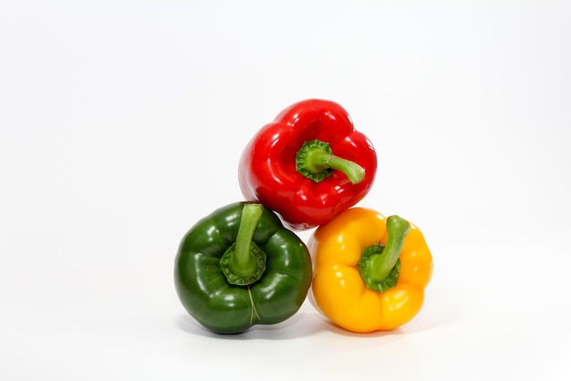 Close-up of red bell peppers on white background