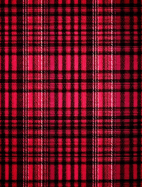 Photo a close up of a red and black plaid fabric generative ai