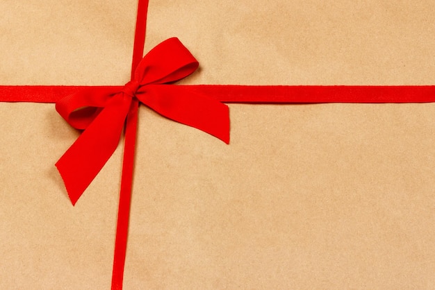 Photo close-up of red bow on paper box