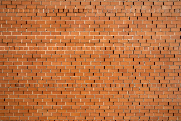 A close up of a red brick wall