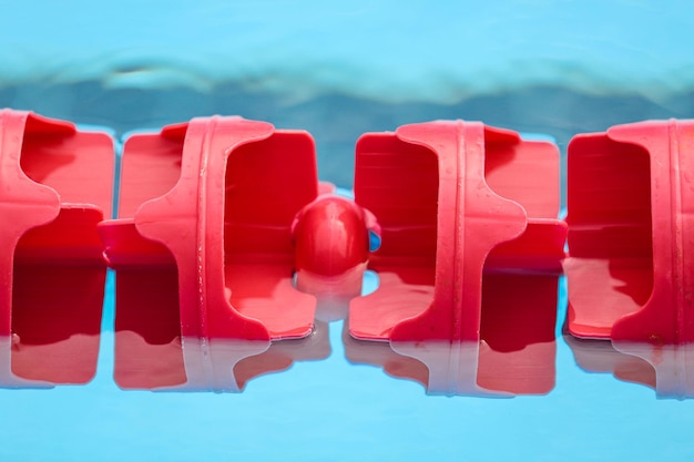 Close-up of red chairs in water