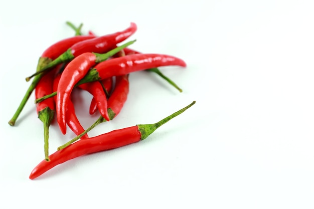 Photo close-up of red chili pepper against white background