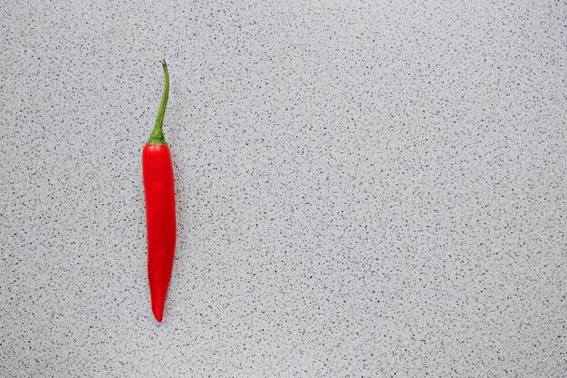 Photo close-up of red chili pepper against white background