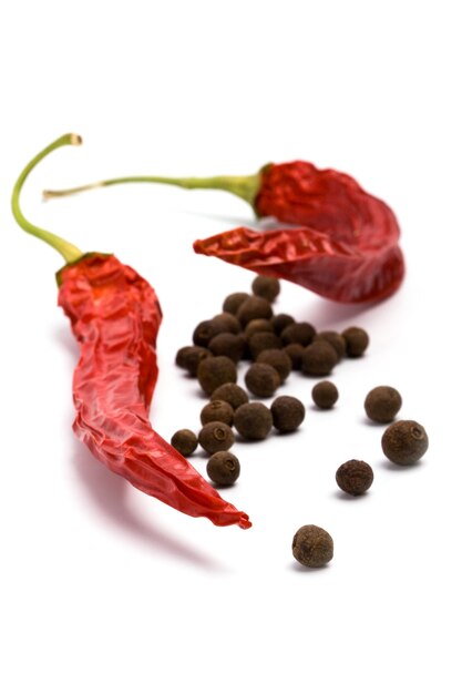 Photo close-up of red chili pepper against white background