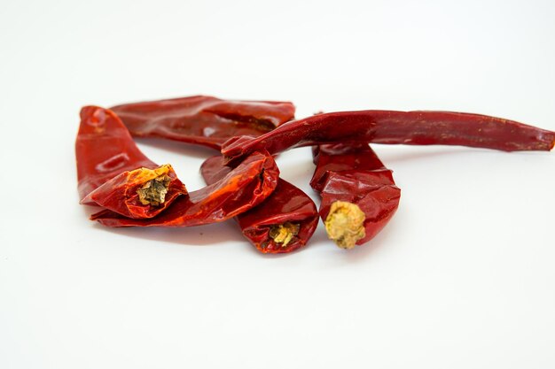 Close-up of red chili pepper over white background